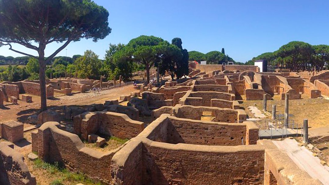 Ancient ruins and trees at Ostia Archaeological Park, Italy.