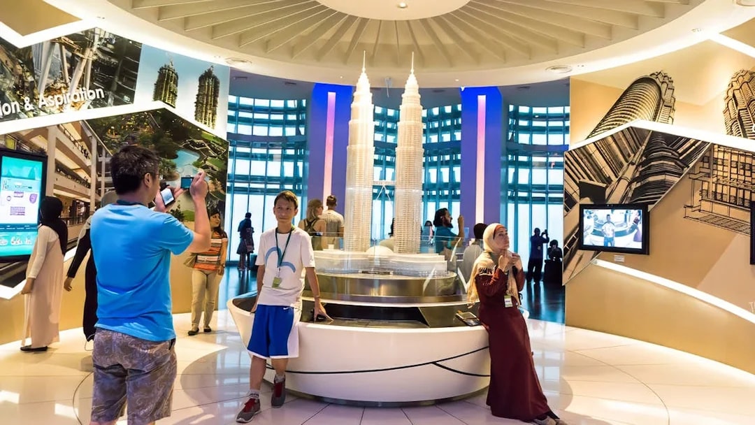 Visitors at Petronas Twin Towers exhibit in Kuala Lumpur, Malaysia.