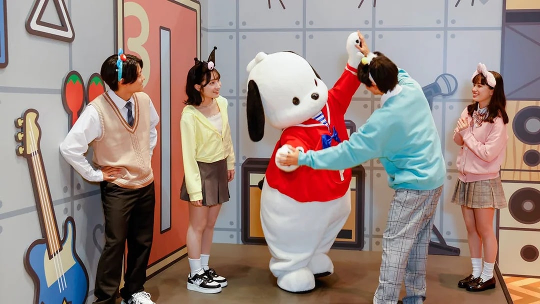 Visitors interacting with a character at Sanrio Puroland.