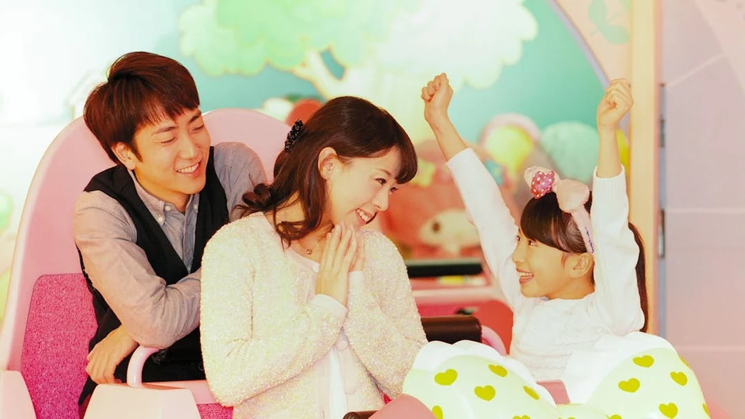 Family enjoying a ride at Sanrio Puroland, Tokyo.