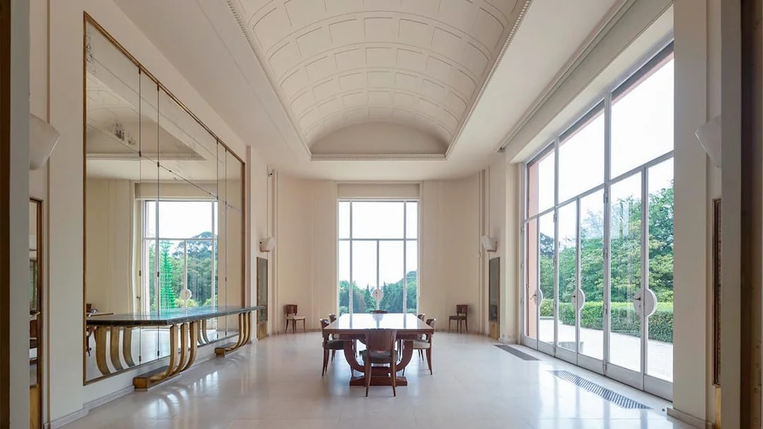 Interior of Serralves Museum with large windows and elegant furniture in Porto, Portugal.
