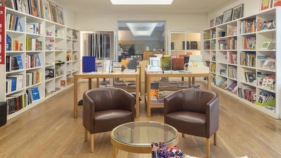Serralves Foundation bookstore with shelves of books and seating area.