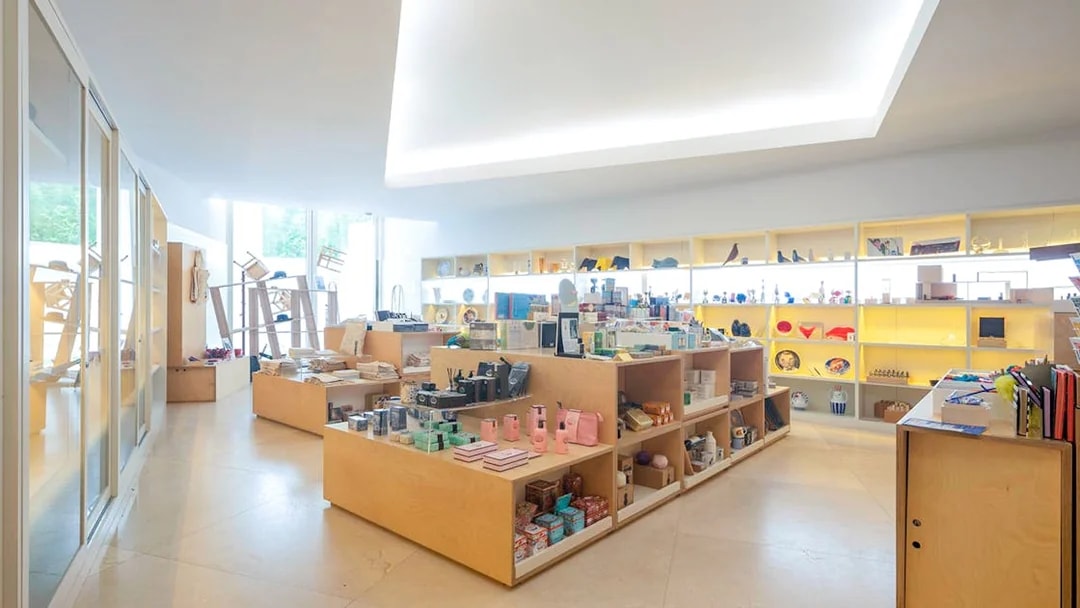 Gift shop interior at Serralves Foundation, Porto, displaying various souvenirs and art items.