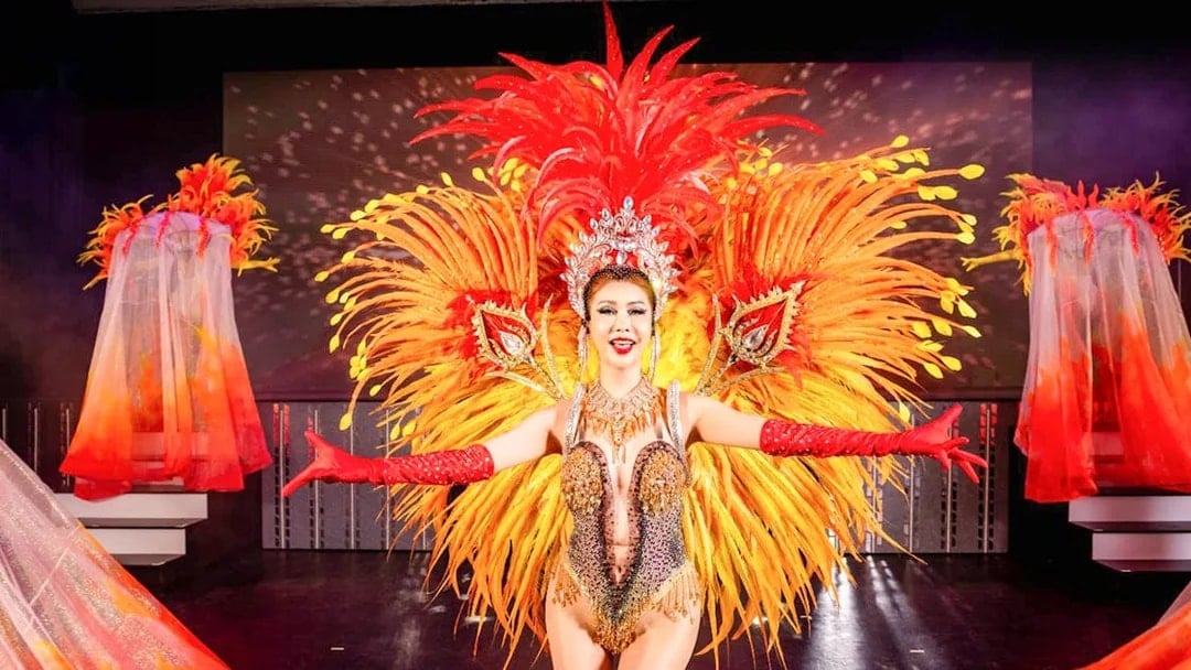 Performer in vibrant costume at Simon Cabaret Show, Phuket.