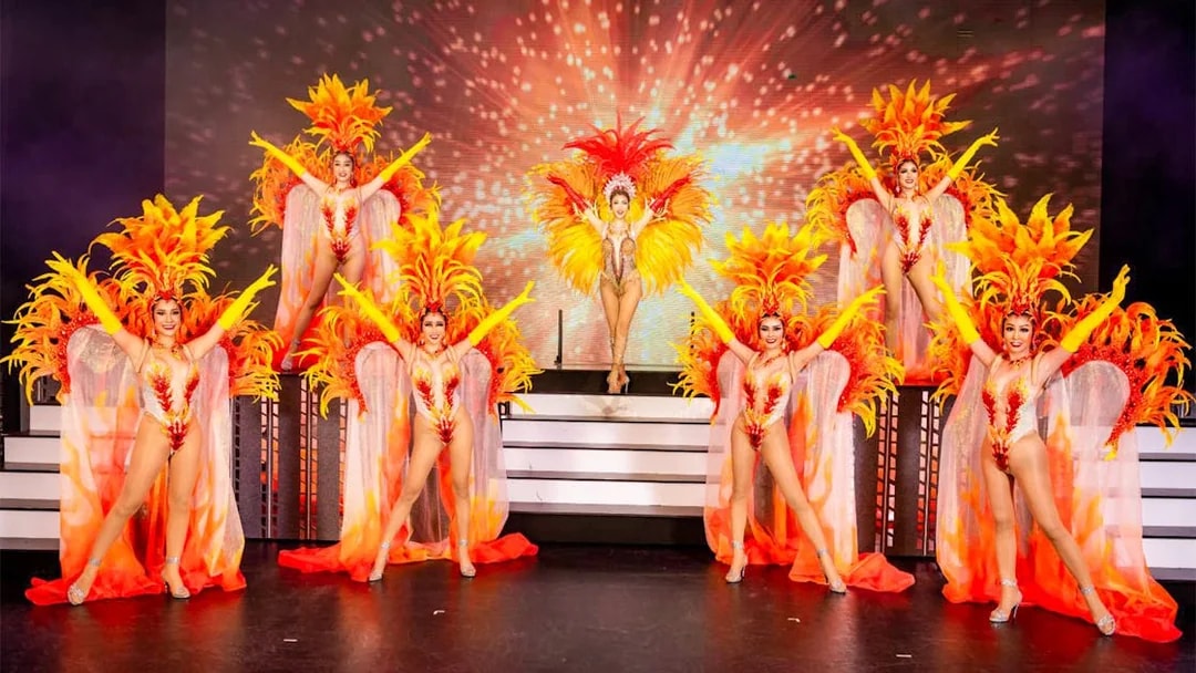 Performers in vibrant costumes at Simon Cabaret Show, Phuket.