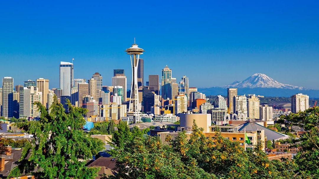 Seattle skyline with Space Needle and Mt Rainier in the background.