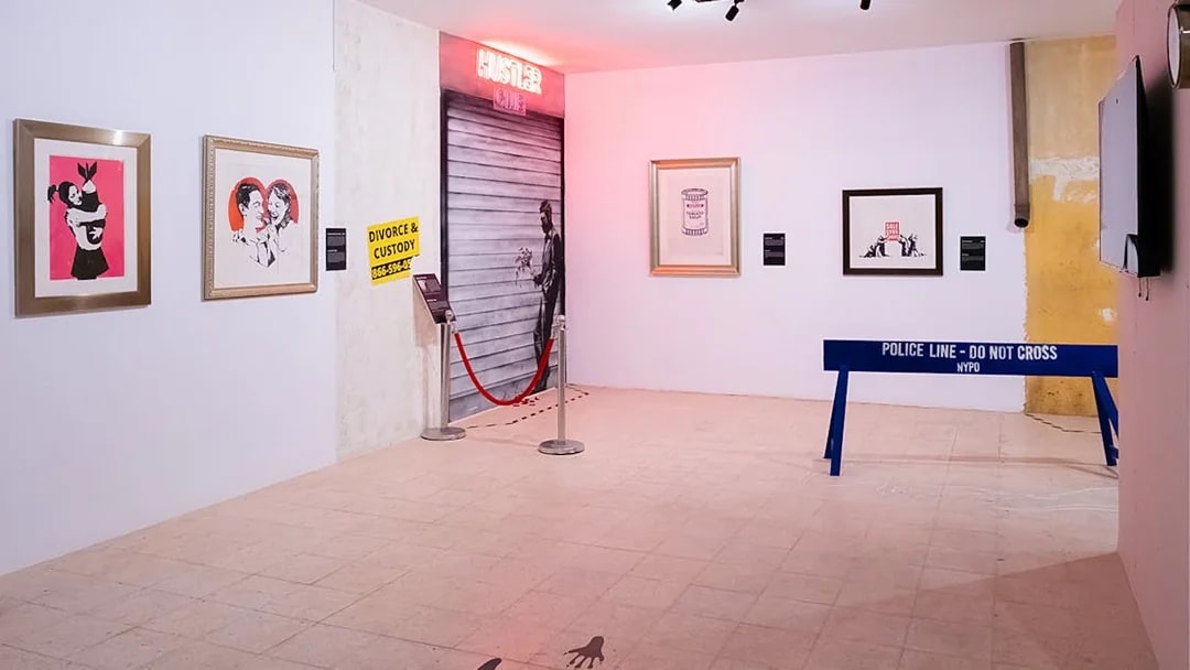 Banksy Museum exhibit in Lisbon featuring street art and installations.
