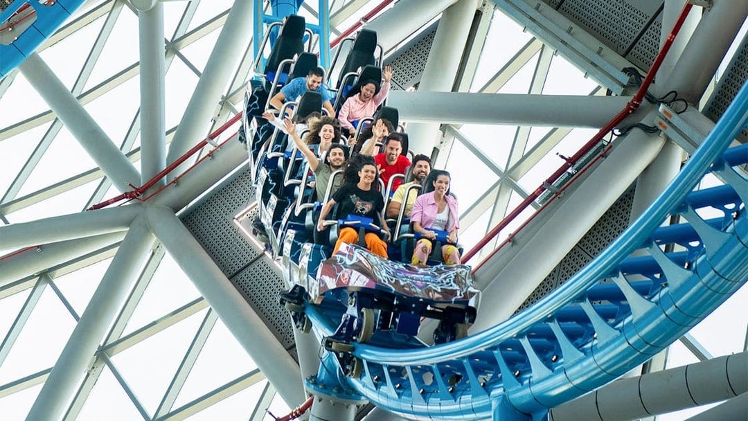 Riders enjoying The Storm Coaster in Dubai's indoor theme park.