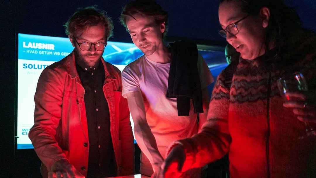 Visitors interacting with an exhibit at Whales of Iceland Museum.