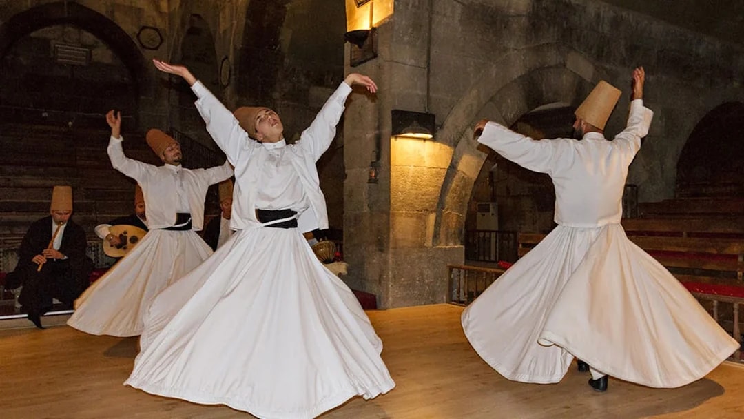 Whirling Dervishes performing in a traditional setting in Cappadocia.