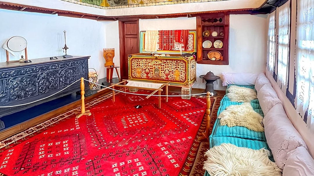 Exhibits inside Skanderbeg Museum featuring traditional Albanian decor and artifacts.