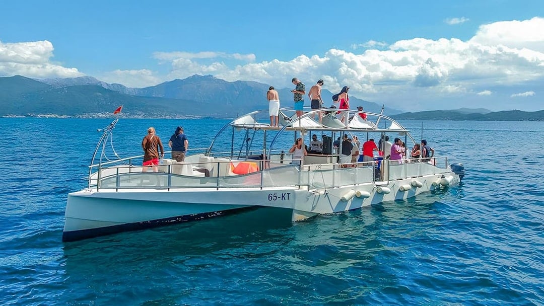 Guests enjoying the Blue Cave & Our Lady of The Rock boat tour.
