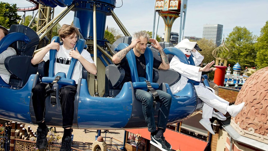 Visitors enjoying a ride at Tivoli Gardens amusement park in Copenhagen.