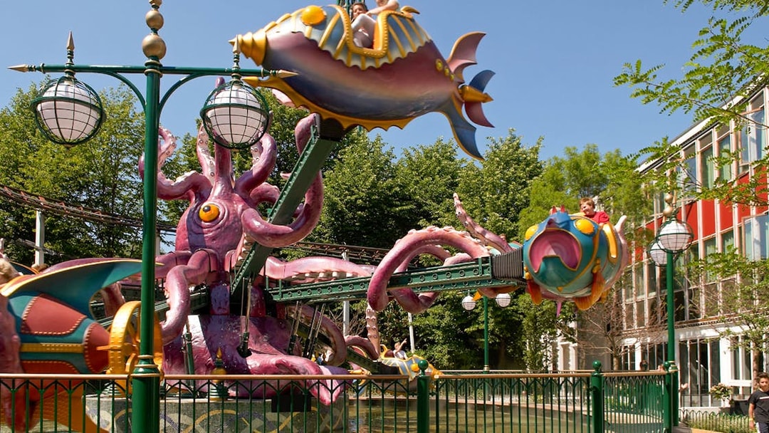 Tivoli Gardens ride with colorful fish-shaped cars and octopus structure.