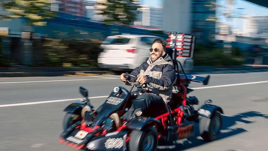 Man driving a go-kart on Asakusa street during 60-minute tour.