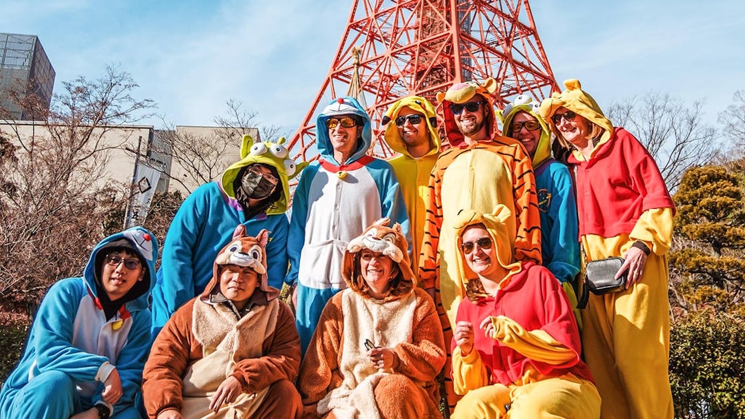 Group in costumes posing on Tokyo Shibuya Street for Go-Kart Experience.