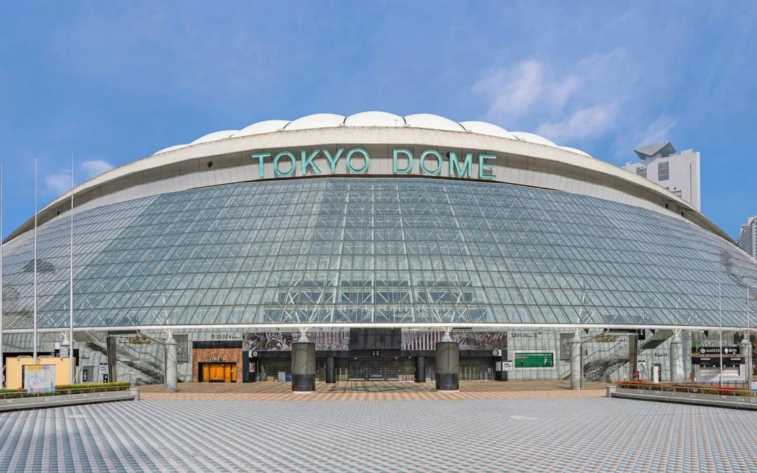 Tokyo Dome exterior with glass facade and entrance in Tokyo, Japan.