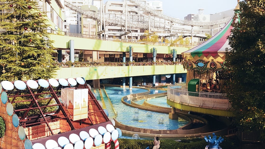 Tokyo Dome City amusement park with carousel and water ride.