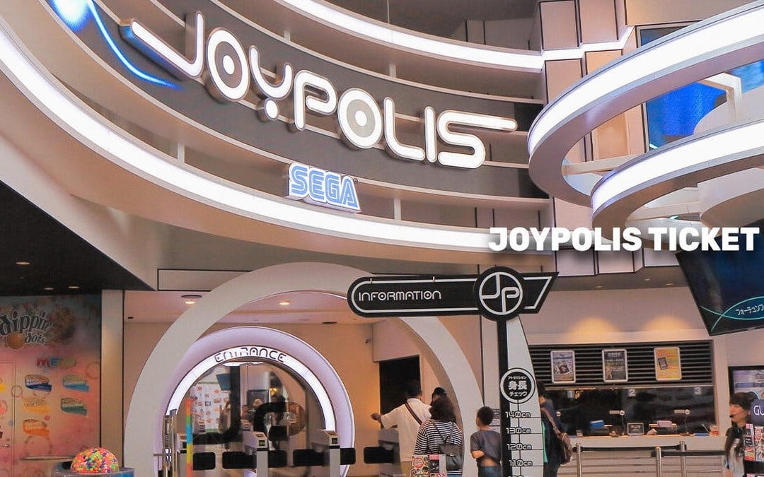 Joypolis entrance in Tokyo with visitors at ticket counter.