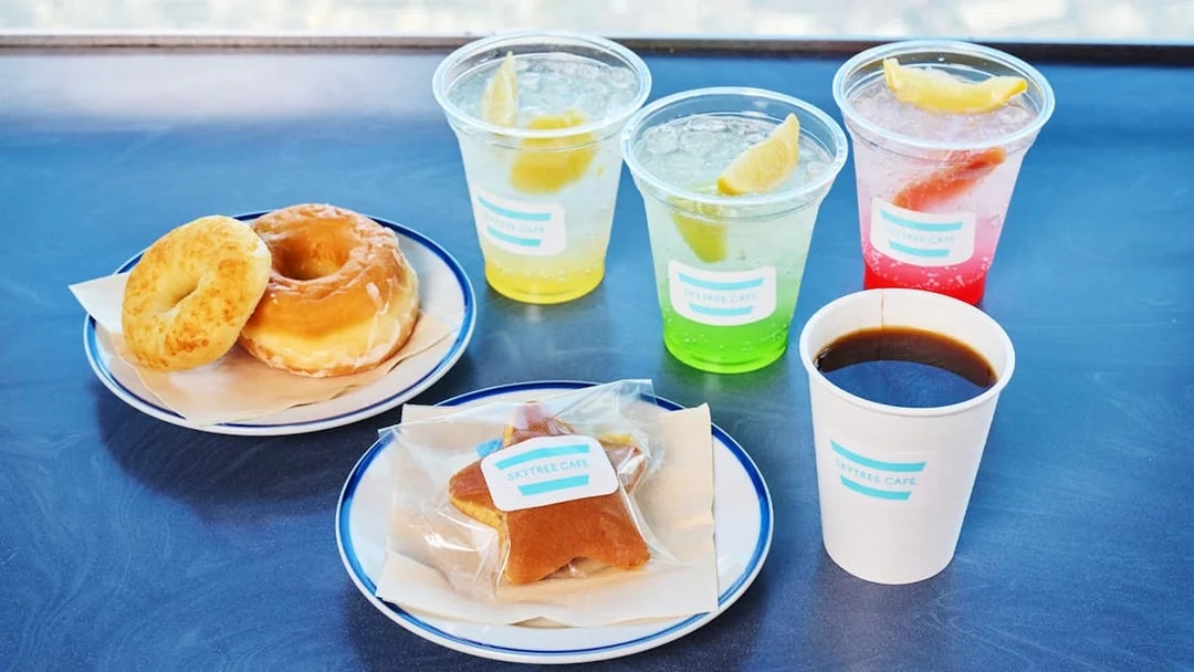 Soft drinks and snacks platter at Tokyo Skytree Cafe with donuts and coffee.