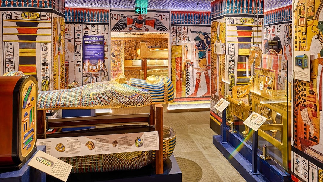 Sarcophagus and Egyptian artifacts displayed at the Tomb of the Pharaoh exhibit.