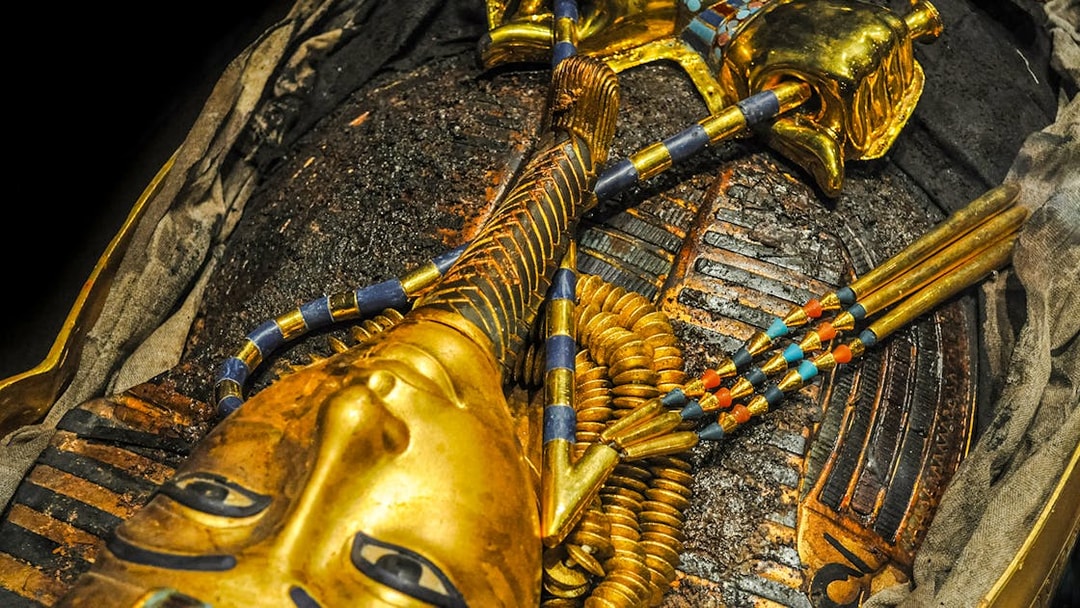 Golden mask of a pharaoh in the Tomb of the Pharaoh, Cairns exhibit.