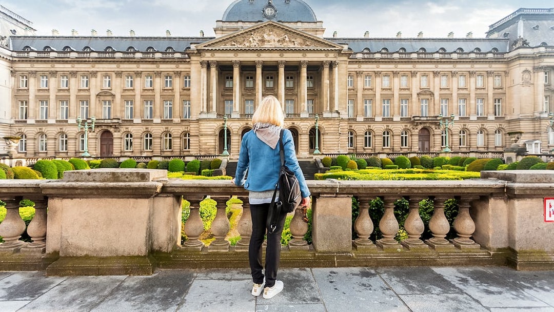 Royal Palace of Brussels viewed from the garden during a hop-on hop-off bus tour.