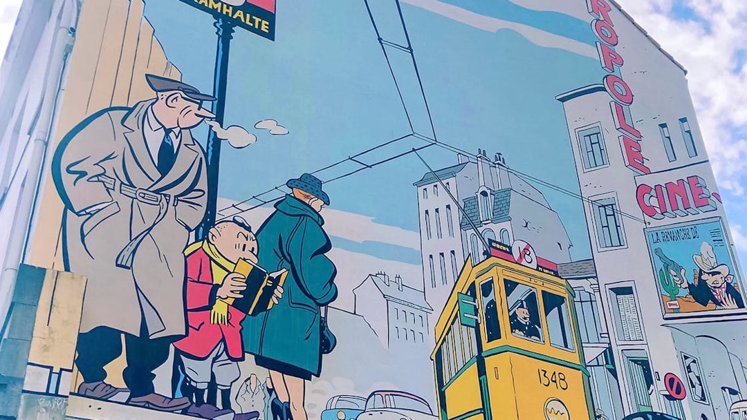 Comic mural featuring characters and a tram in Brussels, seen on the hop-on hop-off bus tour.