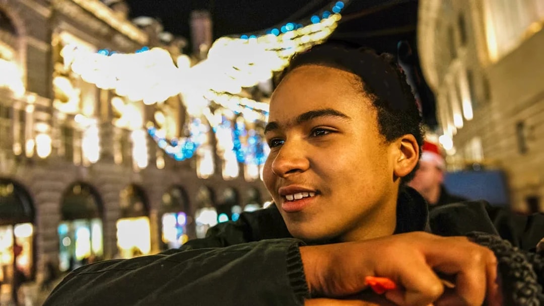 Person enjoying London Christmas lights from Tootbus double-decker tour.