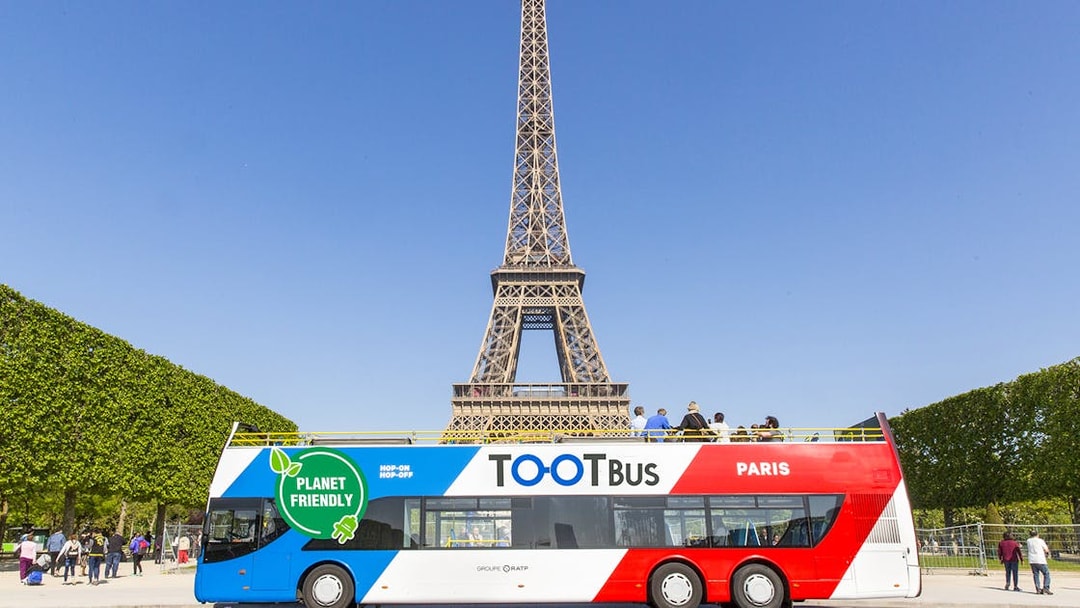 Hop-on hop-off bus near Eiffel Tower, Paris.