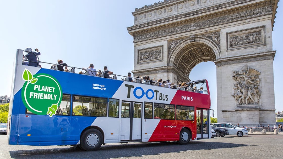 Hop on hop off Toot bus near Arc de Triomphe, Paris.