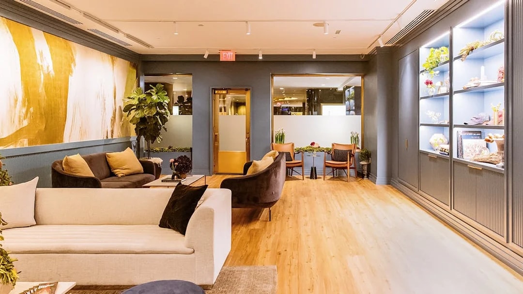 Luxurious lounge area at Top of the Rock Observation Deck with modern decor and seating.