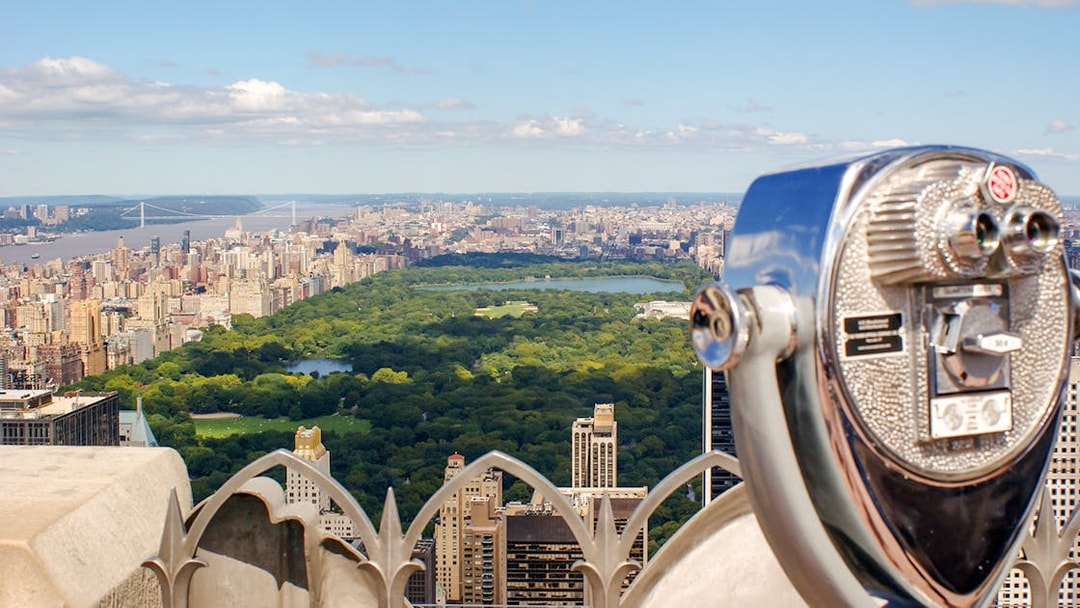 Skyline view of Manhattan and Central Park from a New York City observation deck.