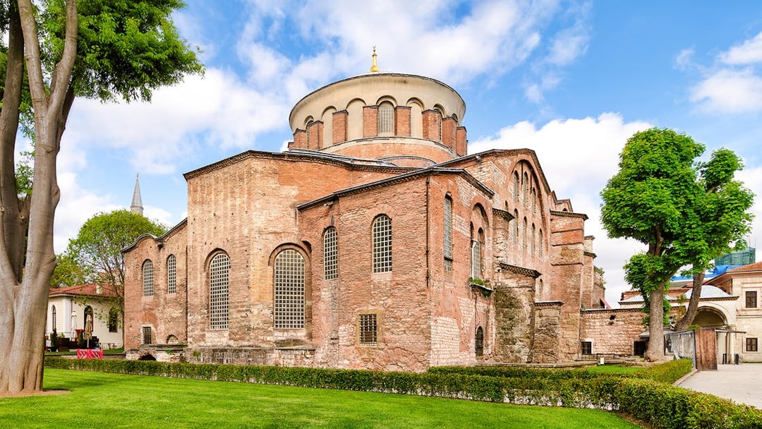 Hagia Irene in the first courtyard of Topkapi Palace, Istanbul, with historic architecture.