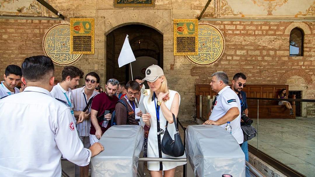 Visitors entering Topkapi Palace during a guided tour in Istanbul.