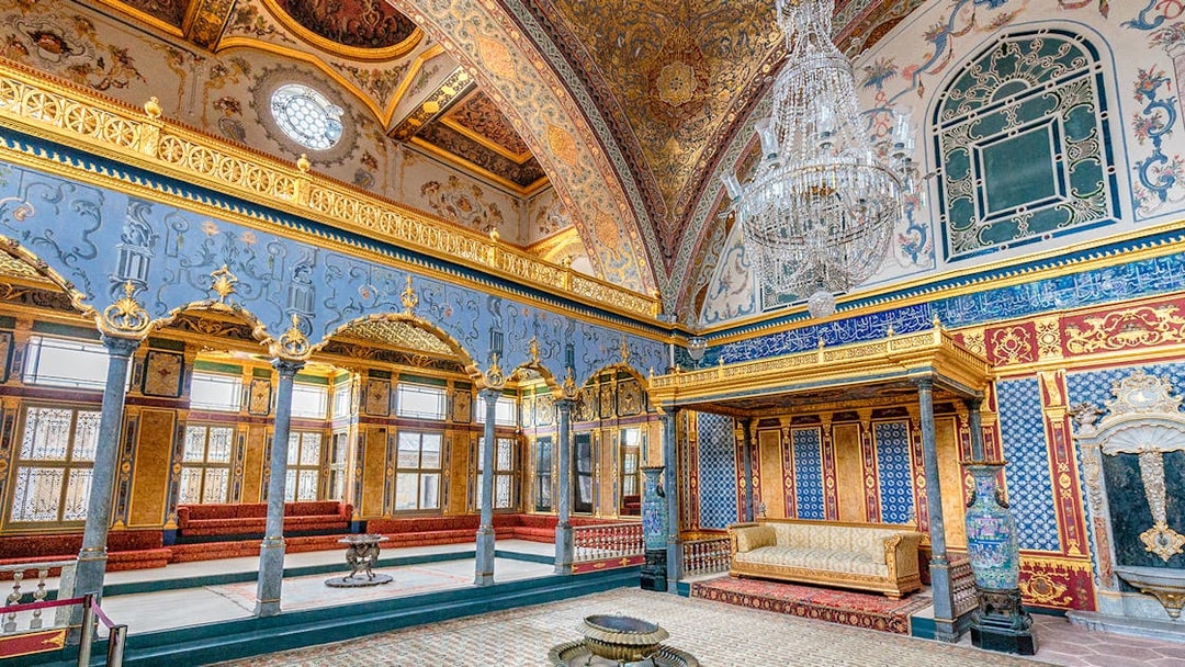 Topkapi Palace ornate interior with chandeliers and intricate wall designs, Istanbul.