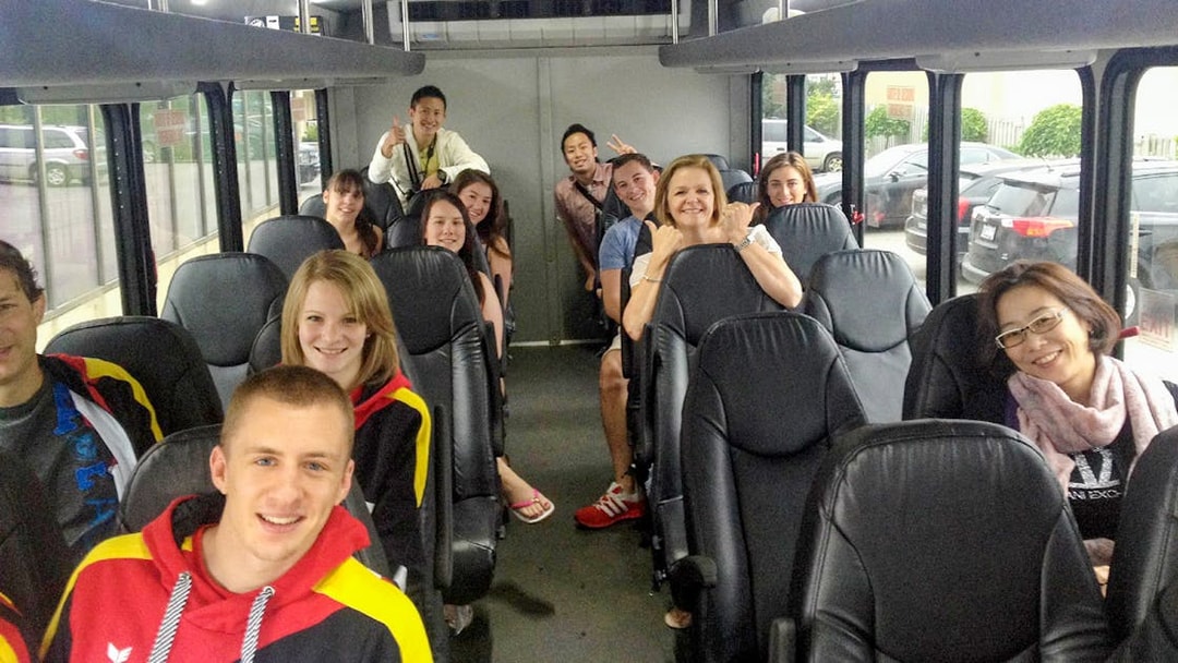 Tour group on a bus departing from Toronto for a Niagara Falls day trip.