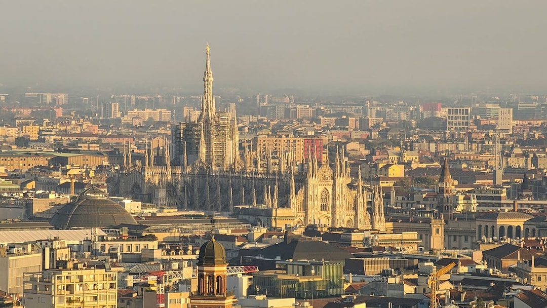 Aerial view of Milan featuring the Duomo and cityscape.