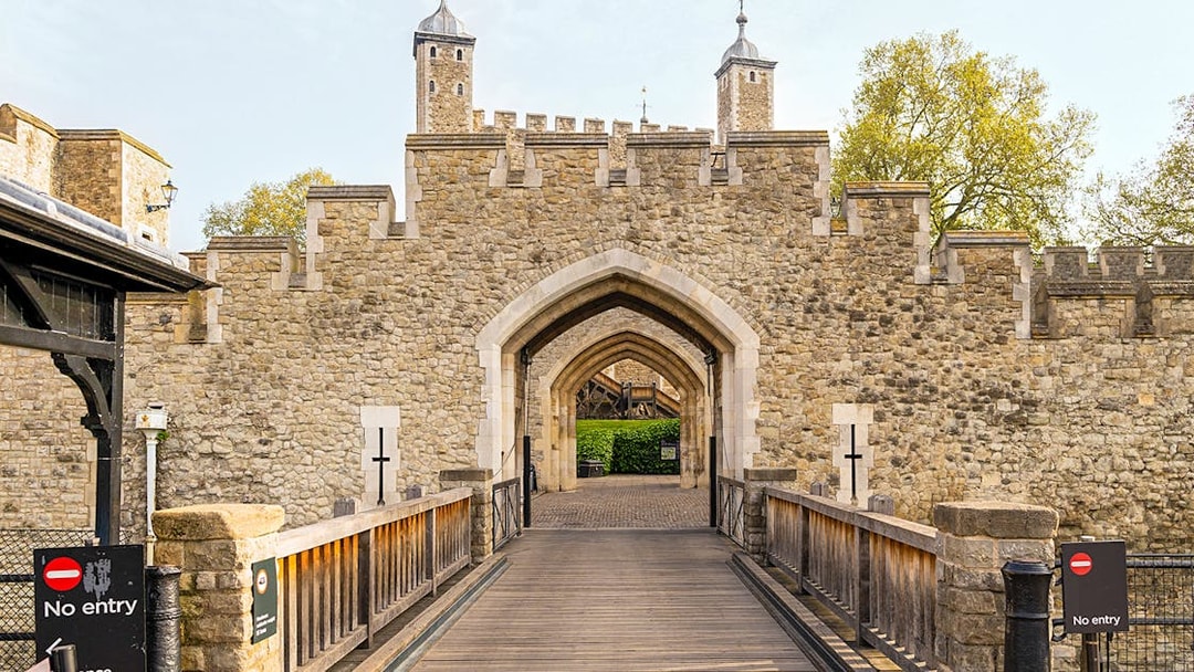 Entrance gate and stone walls of the Tower of London, England.
