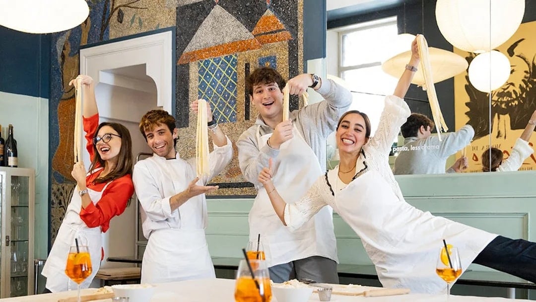 Participants making pasta in a Rome cooking class.