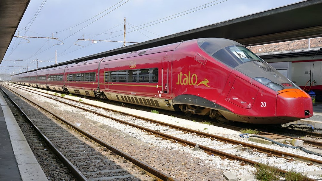 Italo train stationed at a platform in Italy.