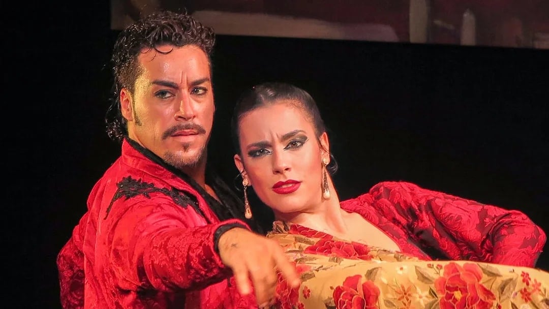 Flamenco dancers performing at Teatro Flamenco Triana in Seville.