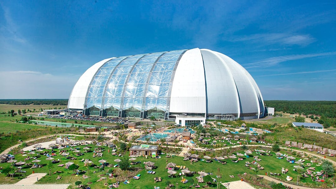 Tropical Islands Resort dome with outdoor pool and sunbathing area in Germany.