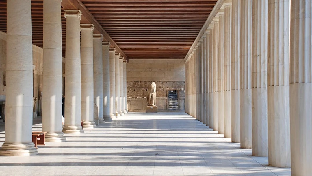 Stoa of Attalos interior with columns and statue, Athens, Greece.