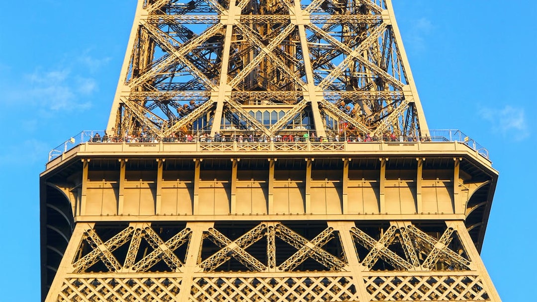 Eiffel Tower viewing platform with visitors, Paris Essentials City Pass.