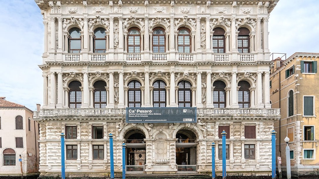 Ca Pesaro baroque marble palace on Grand Canal, Venice, in summer.
