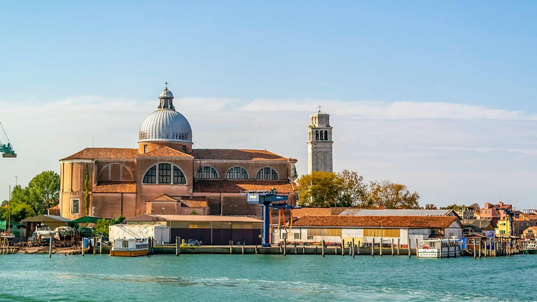 Basilica of San Pietro di Castello with bell tower, Venice waterfront.