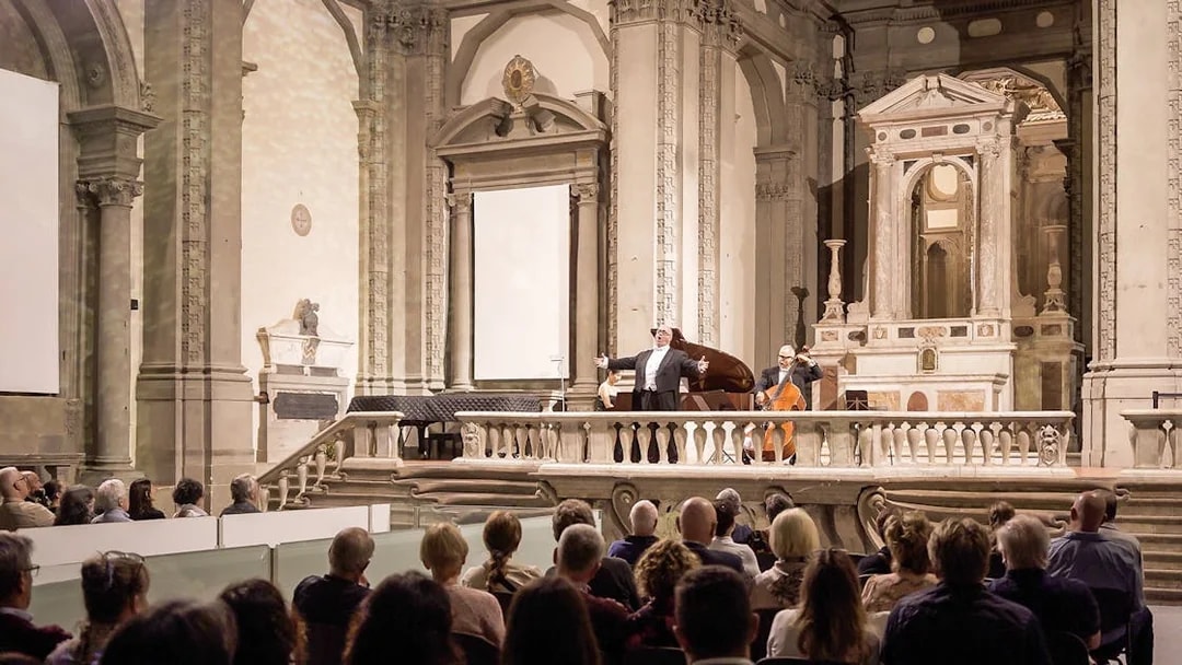 Three tenors performing in a historic Florence venue during a Tuscan dinner concert.