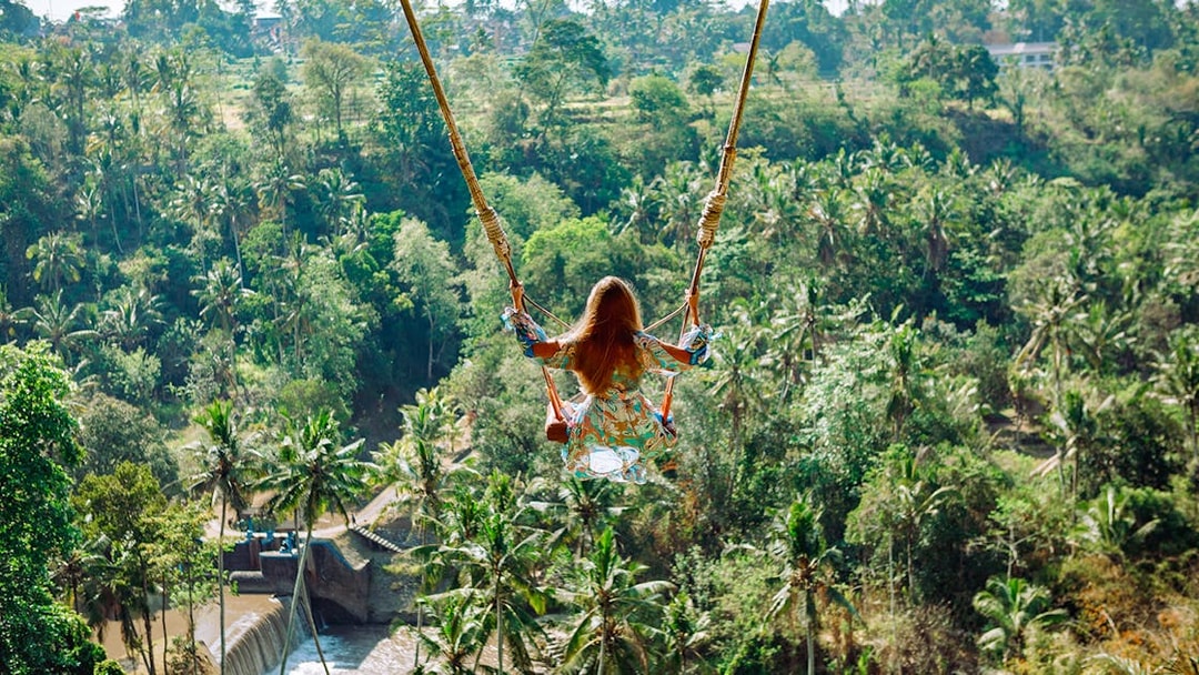 Jungle swing overlooking lush forest in Ubud, part of the Gorilla Face ATV Adventure tour.