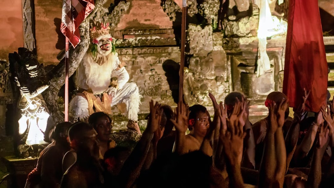 Kecak and Fire Dance performance at Ubud Peliatan Palace with performers in traditional costumes.